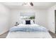 Comfortable bedroom featuring a large window and decorative furnishings at 1058 E 2Nd St, Mesa, AZ 85203
