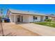 Single-story home featuring a covered parking area, well-maintained lawn, and tidy landscaping at 1058 E 2Nd St, Mesa, AZ 85203