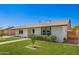 Well-maintained single-story home with a lush green lawn and charming brick pathway leading to the entrance at 1058 E 2Nd St, Mesa, AZ 85203