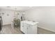 Kitchen with white cabinets, stainless appliances, and an island with seating at 1058 E 2Nd St, Mesa, AZ 85203