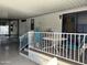 Cozy covered carport featuring a charming deck with white railings, ideal for relaxing and enjoying the outdoors at 111 S Greenfield -- # 602, Mesa, AZ 85206