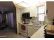 Well-maintained kitchen with white cabinetry, equipped with modern appliances, offering a functional and bright space for cooking at 111 S Greenfield -- # 602, Mesa, AZ 85206