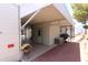 Covered patio area featuring a grill, storage container, and ample space for outdoor entertaining and relaxation at 111 S Greenfield -- # 602, Mesa, AZ 85206