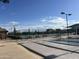 Shuffleboard courts and benches create an inviting outdoor recreation area at 11342 E Laguna Azul Cir, Mesa, AZ 85209