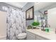 Bathroom with vanity, stylish shower curtain, and decor creating a relaxing and sophisticated space at 1149 N Sunnyvale Ave, Gilbert, AZ 85234