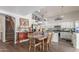 Light-filled dining room with a wooden table, chairs, and stylish decor and staircase to the left at 1149 N Sunnyvale Ave, Gilbert, AZ 85234
