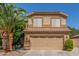 Charming two-story home featuring a tile roof, desert landscaping, and a spacious two-car garage at 1149 N Sunnyvale Ave, Gilbert, AZ 85234