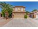 Charming two-story home featuring a tile roof, desert landscaping, and a spacious two-car garage at 1149 N Sunnyvale Ave, Gilbert, AZ 85234