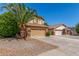 Charming two-story home featuring a tile roof, desert landscaping, and a spacious two-car garage at 1149 N Sunnyvale Ave, Gilbert, AZ 85234