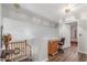 Upper level hallway area featuring wooden desk, chair and access to rooms at 1149 N Sunnyvale Ave, Gilbert, AZ 85234