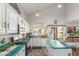Bright kitchen featuring white cabinets, dark countertops, stainless steel appliances, and a view of the backyard at 1149 N Sunnyvale Ave, Gilbert, AZ 85234