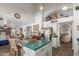 Open kitchen with an island, stainless steel appliances, dining table and decor throughout the home at 1149 N Sunnyvale Ave, Gilbert, AZ 85234
