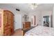 Main bedroom featuring a king bed, wooden floors, decorative chest and closet at 1149 N Sunnyvale Ave, Gilbert, AZ 85234
