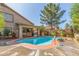 Sparkling swimming pool complemented by lush greenery and shaded patio for ultimate relaxation and entertainment at 1149 N Sunnyvale Ave, Gilbert, AZ 85234