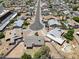 Aerial view of the property and surrounding neighborhood showcasing mature landscaping at 1160 E Hampton Cir, Mesa, AZ 85204
