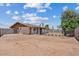 Expansive backyard with fencing offering potential for various outdoor activities at 1160 E Hampton Cir, Mesa, AZ 85204