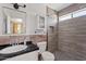 Bathroom featuring tiled shower and modern vanity at 1160 E Hampton Cir, Mesa, AZ 85204