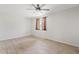 Neutral bedroom featuring tile floors and light brown window coverings at 1160 E Hampton Cir, Mesa, AZ 85204