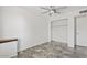 Bedroom featuring neutral tile, ceiling fan, and closet at 1160 E Hampton Cir, Mesa, AZ 85204