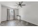 Bright bedroom with a window and neutral tile flooring at 1160 E Hampton Cir, Mesa, AZ 85204