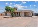 Charming single-story home featuring a covered carport, desert landscaping, and neutral paint at 1160 E Hampton Cir, Mesa, AZ 85204