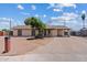 Charming home with mature trees, covered parking, and a well-maintained front yard at 1160 E Hampton Cir, Mesa, AZ 85204
