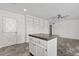 Island kitchen featuring granite countertops and custom shelving at 1160 E Hampton Cir, Mesa, AZ 85204