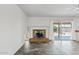 Living room featuring brick fireplace and tile floors at 1160 E Hampton Cir, Mesa, AZ 85204