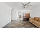 Bright and airy living room featuring neutral walls, a ceiling fan, and tile flooring at 1160 E Hampton Cir, Mesa, AZ 85204