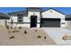 Charming single-story home featuring a two-car garage and low-maintenance desert landscaping at 1162 S Mullberry St, Florence, AZ 85132