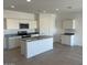 A view of the spacious kitchen with white cabinets, stainless steel appliances, and granite countertops at 1162 S Mullberry St, Florence, AZ 85132