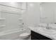 A well-lit bathroom featuring a shower-tub combo and a marble-look countertop vanity at 1373 S Vista Ave, Florence, AZ 85132