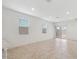 Bright, open-concept living space with large windows providing ample natural light and a sliding glass door to the yard at 1373 S Vista Ave, Florence, AZ 85132