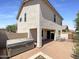 View of the back of the house featuring a paver patio, hot tub, and fenced yard at 1400 S Crossbow Ct, Chandler, AZ 85286