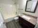 Well-maintained bathroom featuring a shower over tub, granite vanity, and neutral finishes at 1400 S Crossbow Ct, Chandler, AZ 85286