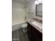 Bathroom featuring granite countertops, tub-shower combo, and neutral walls at 1400 S Crossbow Ct, Chandler, AZ 85286