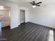 Bedroom featuring gray wood-look floors and closet with open bi-fold doors at 1400 S Crossbow Ct, Chandler, AZ 85286