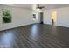 Large bedroom featuring gray wood-look floors and bright windows offering great natural light at 1400 S Crossbow Ct, Chandler, AZ 85286