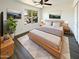 Comfortable bedroom with neutral tones, a large window, and modern furnishings at 1400 S Crossbow Ct, Chandler, AZ 85286
