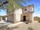 Two-story home featuring a tile roof, neutral stucco, a two-car garage, and low-maintenance landscaping at 1400 S Crossbow Ct, Chandler, AZ 85286