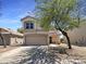 Charming two-story home featuring a well-manicured front yard and a two-car garage at 1400 S Crossbow Ct, Chandler, AZ 85286