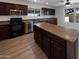 This updated kitchen offers a central island and stainless steel appliances at 1400 S Crossbow Ct, Chandler, AZ 85286