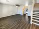 An open-concept living room shows wood-look floors and entry to the half bath at 1400 S Crossbow Ct, Chandler, AZ 85286