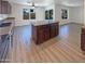 A modern kitchen with a center island opens up to the main living area at 1400 S Crossbow Ct, Chandler, AZ 85286