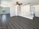 Bright loft area with modern ceiling fan, neutral walls, and attractive gray wood-look floors at 1400 S Crossbow Ct, Chandler, AZ 85286