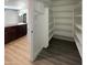 Large walk-in pantry provides ample shelving for all your storage needs at 1400 S Crossbow Ct, Chandler, AZ 85286