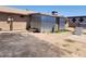 Spacious backyard featuring a metal shed and large dirt area, offering possibilities for outdoor activities at 1602 N 57Th Ave, Phoenix, AZ 85035
