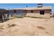 Spacious backyard featuring a metal shed, large dirt area, and exterior windows at 1602 N 57Th Ave, Phoenix, AZ 85035