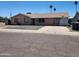 Charming single-story home featuring a xeriscaped front yard, driveway, and neutral-toned stucco exterior at 1602 N 57Th Ave, Phoenix, AZ 85035