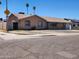 Lovely one-story home featuring desert landscaping, a paved driveway, and a secure gated entrance at 1602 N 57Th Ave, Phoenix, AZ 85035